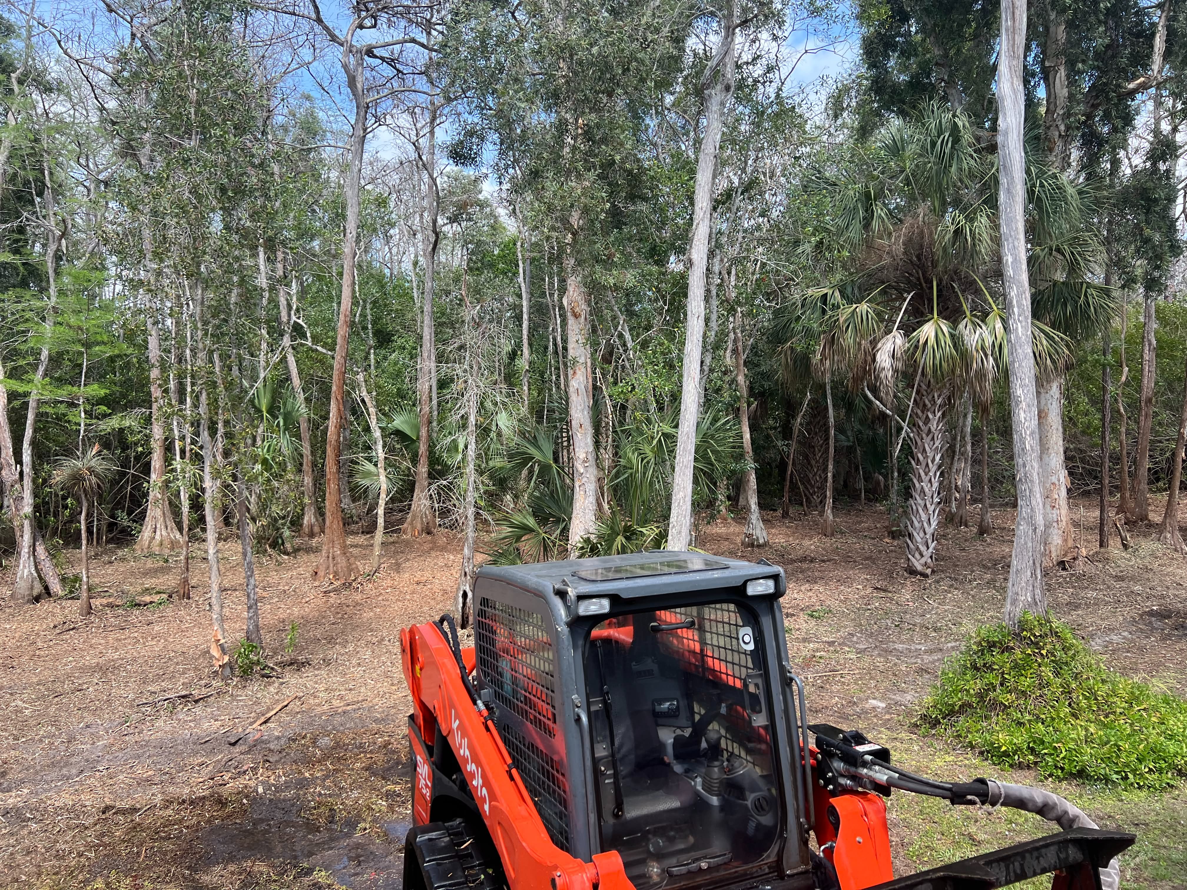 Kubota track loader performing grading and earth moving